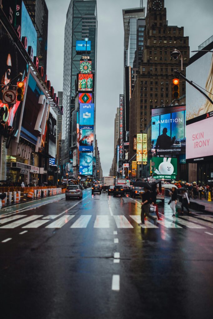 pexels-photo-1705073-1705073 Bustling Times Square in New York City with illuminated billboards and pedestrians crossing.